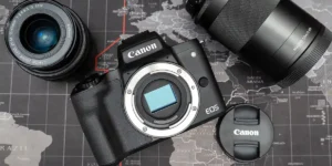 How do I clean my Canon M50 Mark II lens?